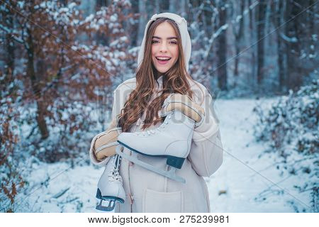 Girl Playing With Snow In Park. Women On Mountain. Beautiful Girl In The Winter Forest In White Down