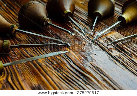 Different Gravers For Jewelry On A Wooden Background