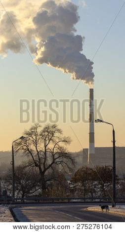 Smoke From Industrial Chimneys Against The Blue Sky. Pollution.