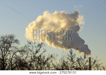 Smoke From Industrial Chimneys Against The Blue Sky. Pollution.
