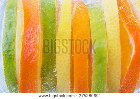 Different Sliced Citrus Like One Whole Fruit. Fruit Background.