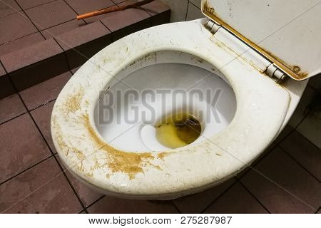 Dirty Smelly Toilet Bowl With Stain And Limescale