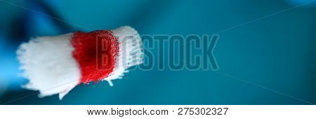 Surgeon In Sterile Uniform Arms Holding And Passing To Colleague Tools With Bio Material Wad Closeup