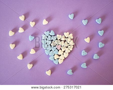 Heart From Small Hearts Tablets, Sweet Vitamins On Tinted Paper, Top View, Concept Of Love, Health, 