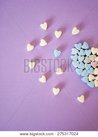 Half A Big Heart From Small Heart Tablets, Sweet Vitamins On Tinted Paper, Top View, Concept Of Love