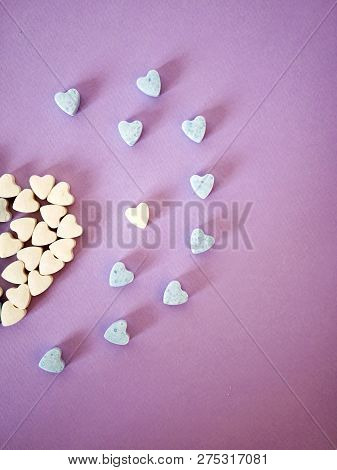 Half A Big Heart From Small Heart Tablets, Sweet Vitamins On Tinted Paper, Top View, Concept Of Love