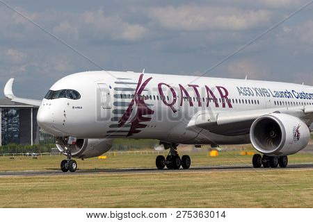 Farnborough, Uk - July 16, 2014: Airbus A350-941 Commercial Aircraft With A Hybrid Airbus/qatar Airw