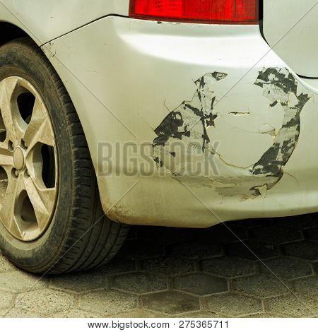 Crash From Grey Car Accident. Cracks On The Bumper