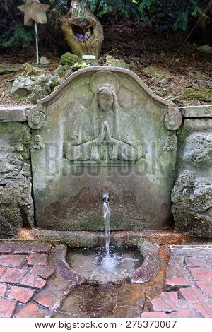 RETZBACH, GERMANY - JULY 04, 2018: Brunnleswasser Well, Maria im Grunen Tal pilgrimage church in Retzbach in the Bavarian district of Main-Spessart, Germany