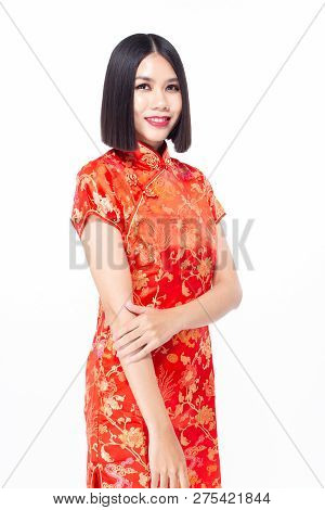 Chinese Woman Wear Qipao For Chinese New Year Day With Attractive Smile, Isolated On White Backgroun