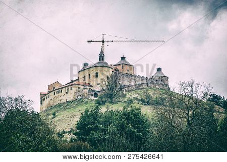 Krasna Horka Castle Under Reconstruction With Crane, Slovak Republic. Travel Destination. Cultural H