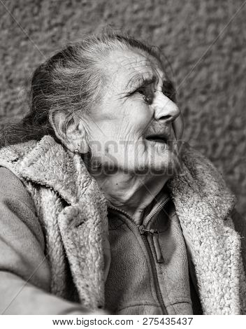 Very Old And Tired Wrinkled Woman Outdoors