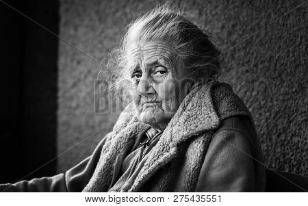 Very Old And Tired Wrinkled Woman Outdoors