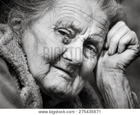 Very Old And Tired Wrinkled Woman Outdoors