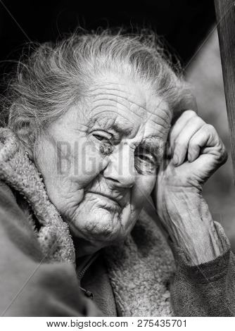 Very Old And Tired Wrinkled Woman Outdoors