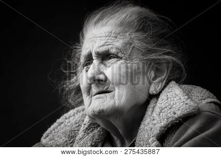Very Old And Tired Wrinkled Woman Outdoors