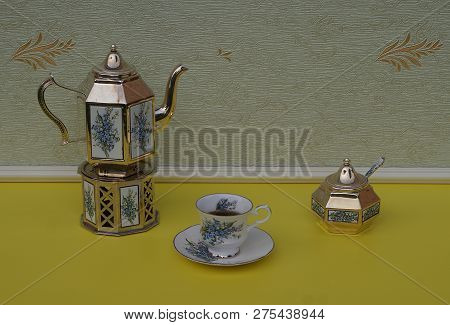 English Teacup, Saucer, Silver-plated Teapot On A Silver Stove, Sugar Bowl And Sugarspoon, With Flor