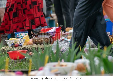 Tocuz, Moldova- 16 April, 2018: Goods On The Graves In The Cemetery Celebrating The Dead During Memo