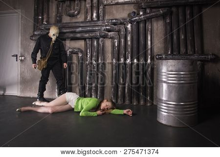A Man In A Gas Mask Carries Away A Suffocated Girl