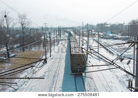 Rail Cars Loaded With The Wood Being Transported From Nearby Mines To Power Plants In Winter
