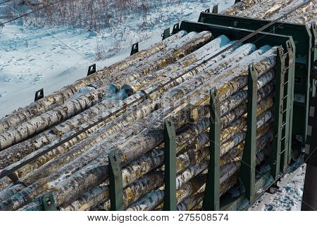 Rail Cars Loaded With The Wood Being Transported From Nearby Mines To Power Plants In Winter