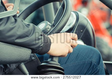 Man Operating Agricultural Or Industrial Machine, Steering Wheel And Control Panel As Part And Detai