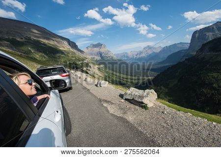 Sept 1 2018 - Swiftcurrent, Mt: Blonde Female Admires The Beautiful Mountain Scenery Along Going To 
