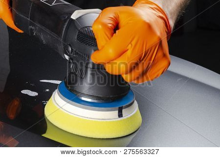 Car Polish Wax Worker Hands Applying Protective Tape Before Polishing. Buffing And Polishing Car. Ca