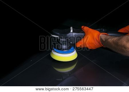 Car Polish Wax Worker Hands Applying Protective Tape Before Polishing. Buffing And Polishing Car. Ca