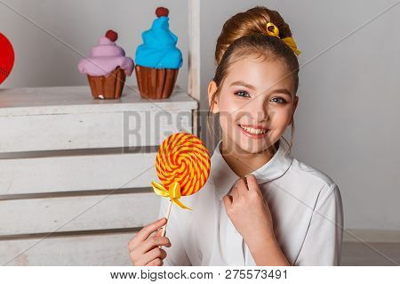 Beautiful Teenage Girls In Pink Tutu Skirts With Lollipops And Macaroons And Fansy Cakes In Studio O