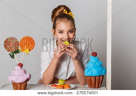 Beautiful Teenage Girls In Pink Tutu Skirts With Lollipops And Macaroons And Fansy Cakes In Studio O