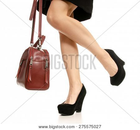 Woman Legs Feet Black Dress Shoes Red Purse Bag On White Baclground Isolation