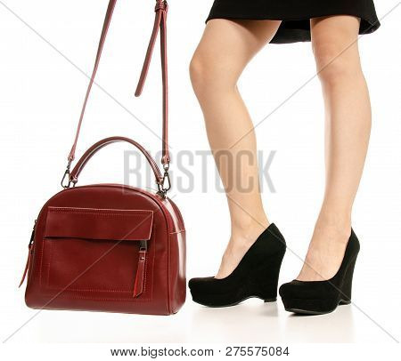 Woman Legs Feet Black Dress Shoes Red Purse Bag On White Baclground Isolation