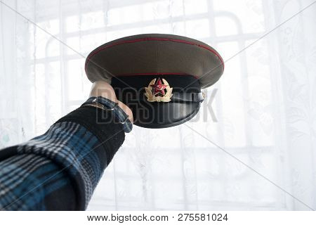 Man Holding The Soviet Union Military Officer Cap With Red Star.