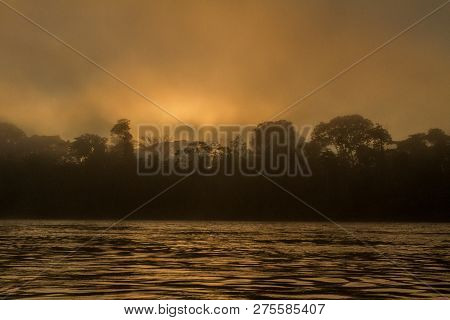 Madre De Dios River In Manu National Park With Scenery Of Tropical Rain Forest In The Peruvian Amazo