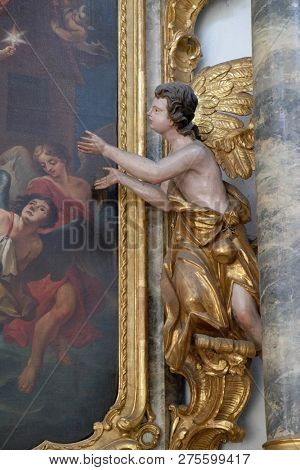 WURZBURG, GERMANY - JULY O4, 2018: Angel statue on the St. Michael altar in the Neumunster Collegiate Church in Wurzburg, Germany