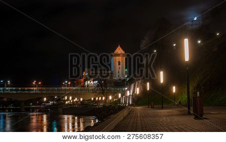 Night View Of Narva Castle With The Tower Of High Herman, Narva, Estonia. The Castle Is Illuminated.