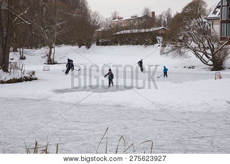 Outdoor Ice Hokey, Players And Frozen Pond. Travel Photo 2018.