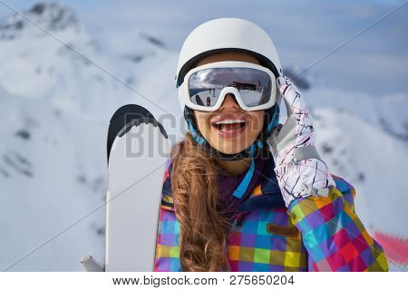              Happy Young Woman Skier Enjoying Sunny Weather In Alps Stock Photo                   