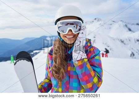              Happy Young Woman Skier Enjoying Sunny Weather In Alps Stock Photo                   