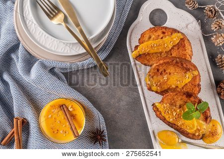 Traditional Christmas Rabanadas With Egg Yolk Cream And Cinnamon. Spanish Torrijas Close Up On The C