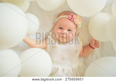 I Want To Play. Portrait Of Happy Little Child In White Balloons. Sweet Little Baby. New Life And Bi
