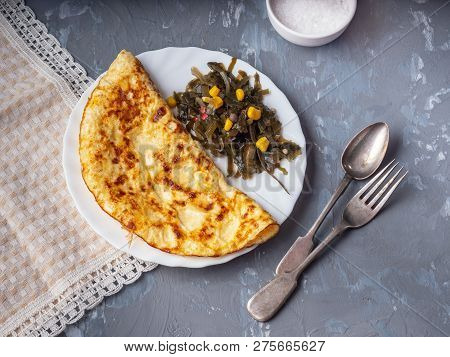 Breakfast Of Omelet And Sea Katusta On A Decorative Napkin, Cutlery