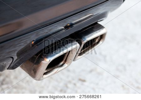 Novosibirsk, Russia - 08.01.2018: Tuning The Muffler And Shiny Chrome-plated Exhaust Pipes Of A Blac