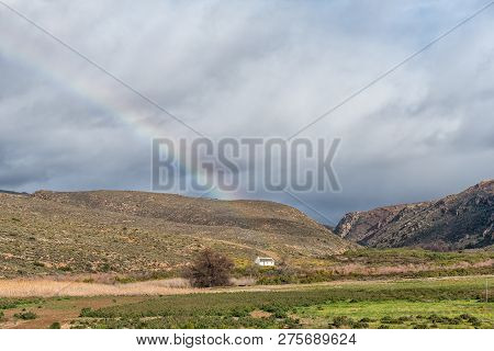 Rainbow Landscape At Matjiesrivier In The Cederberg Mountains. An Historic House And A Rainbow Are V