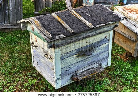 Old Empty Beehive In The Garden Near The Fence