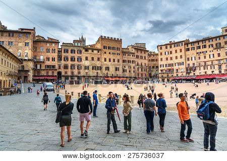 Siena, Italy - October 02, 2018: Tourists On Piazza Del Campo, Square And Historic Center In Siena