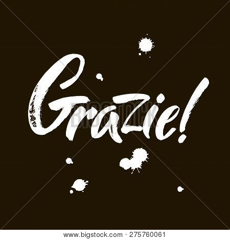 Grazie - Thank You In Italian. Calligraphy Inscription, White Word On Black Background. Handwritten 