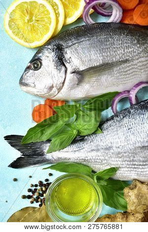 Uncooked Organic Dorado Or Sea Bream With Ingrediets For Making.top View .