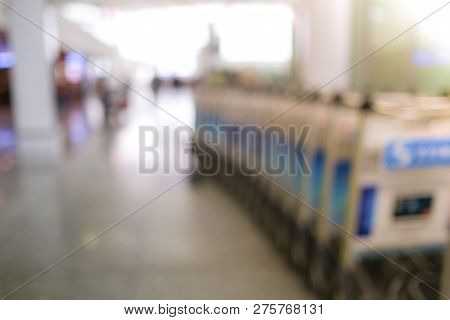 Blurred Defocused Image Of Airport Luggage Cart, Trolleys Luggage In Airport Or Market, Mall, Superm